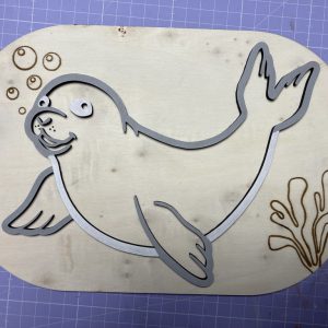 Insert en bois pour bac Trofast d'un phoque en relief pour remplissage avec riz ou petites graines